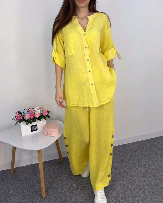 Enfärgad knappficka spetsblus byxor med vida ben