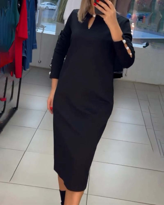 Elegant klänning med pärlknappar