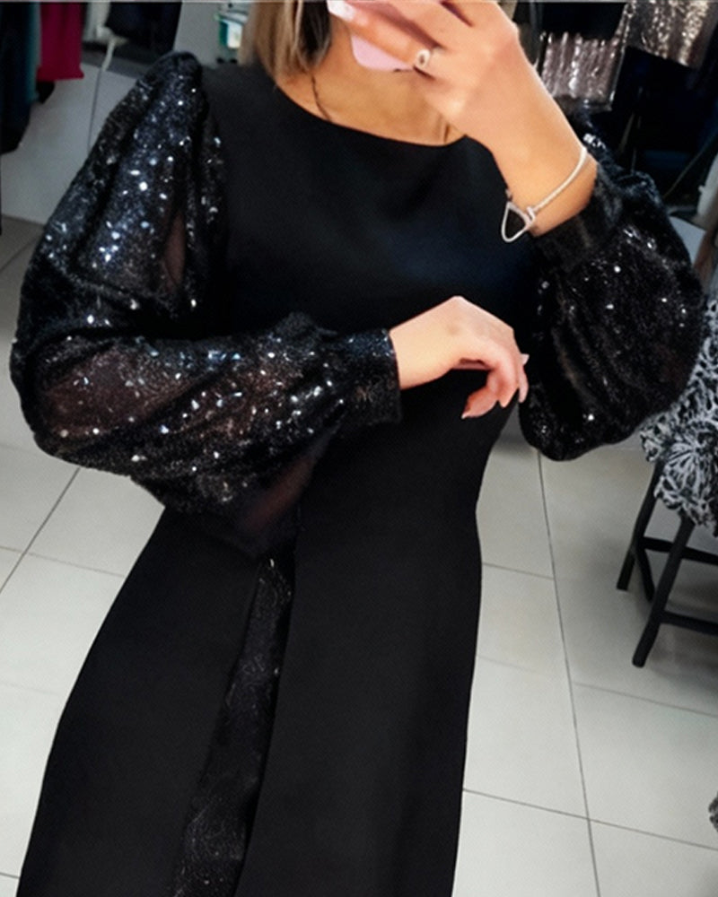 Elegant Klänning Med Puffärmar Och Lapptäcktsdetaljer