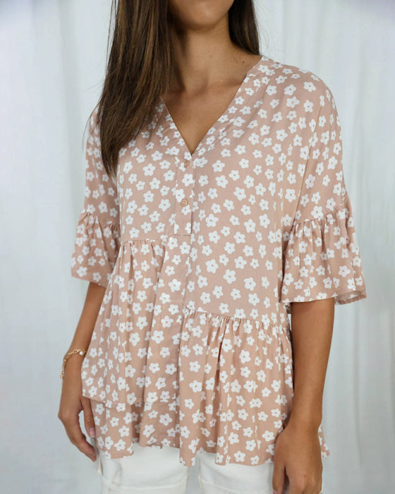 Blommig blus med V-ringad klockärm