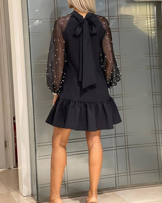 Enfärgad Långärmad Klänning Med Band