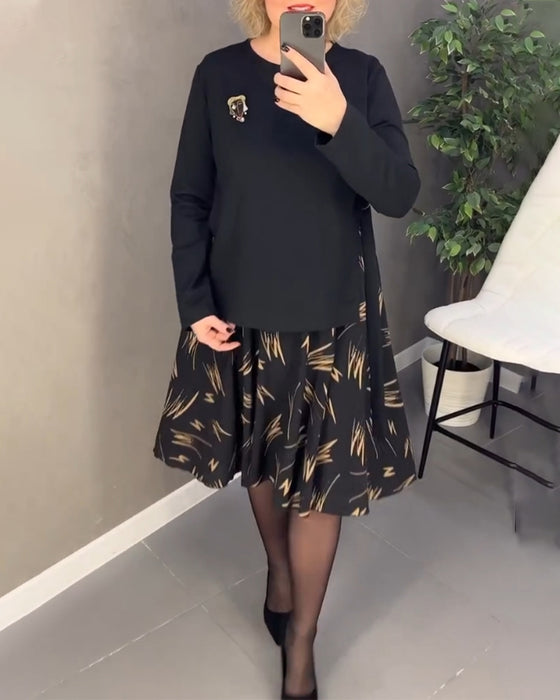 Avslappnad klänning med lös passform och rund hals