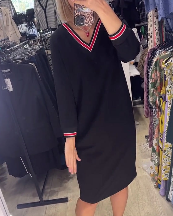 V-ringad klänning med fickor