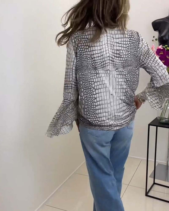 Blus med blommönster och snodd