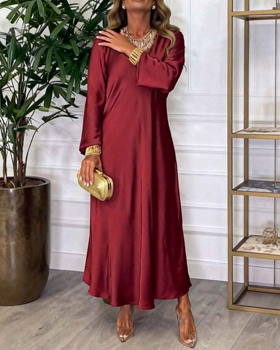 Elegant Klänning Med Lång Ärm Och V-Ringning