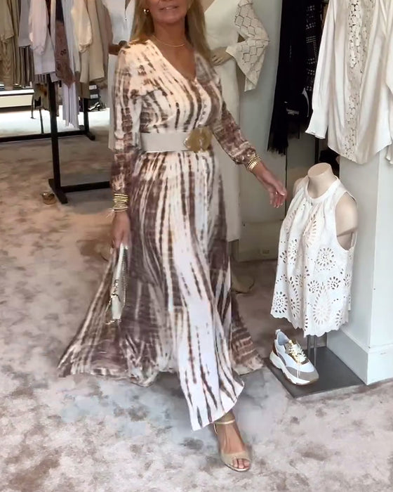 Tryckt långärmad klänning med V-ringad slits i midjan