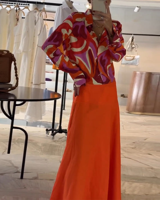 Färgglad blus med tryck och knappar