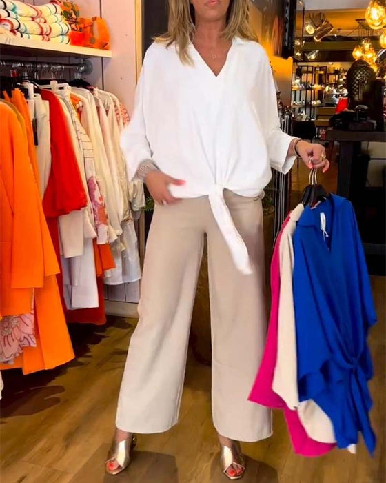 Knytblus i enfärgad V-ringning