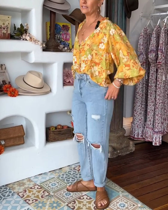 V-ringad blus med blommönster