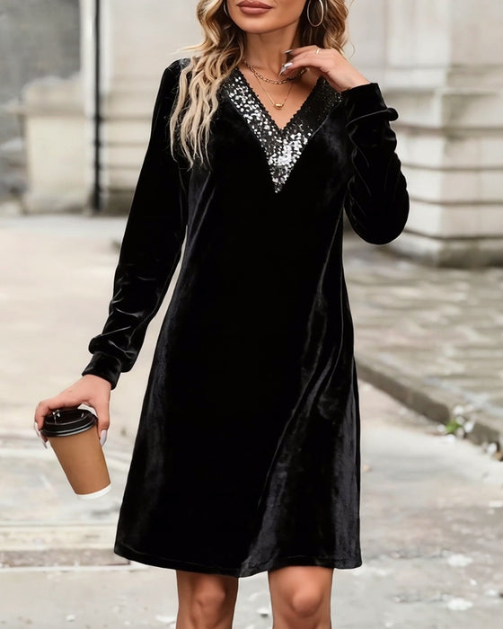 Elegant klänning med v-ringning och paljetter