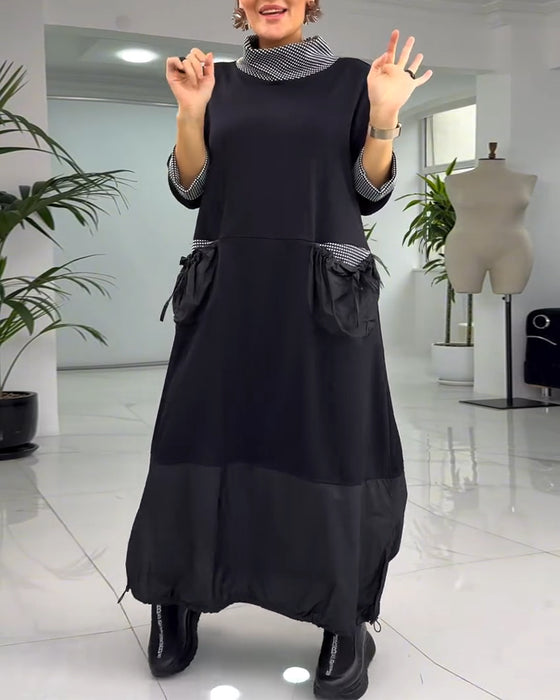 Avslappnad rutig lappklänning med hög krage