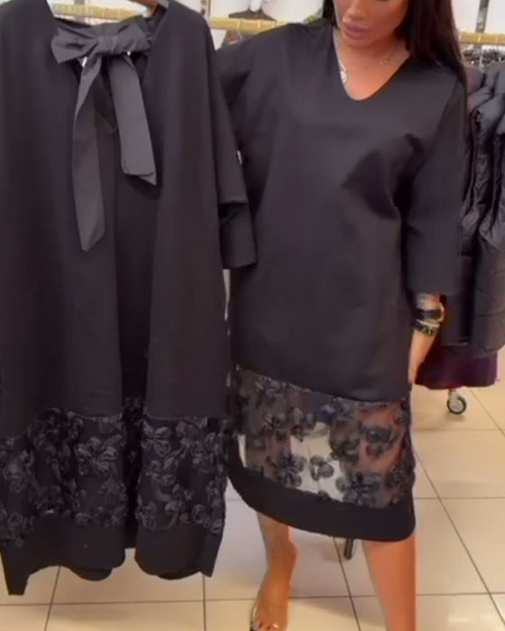 Stilfull Klänning Med Rosett På Ryggen Och V-Ringning