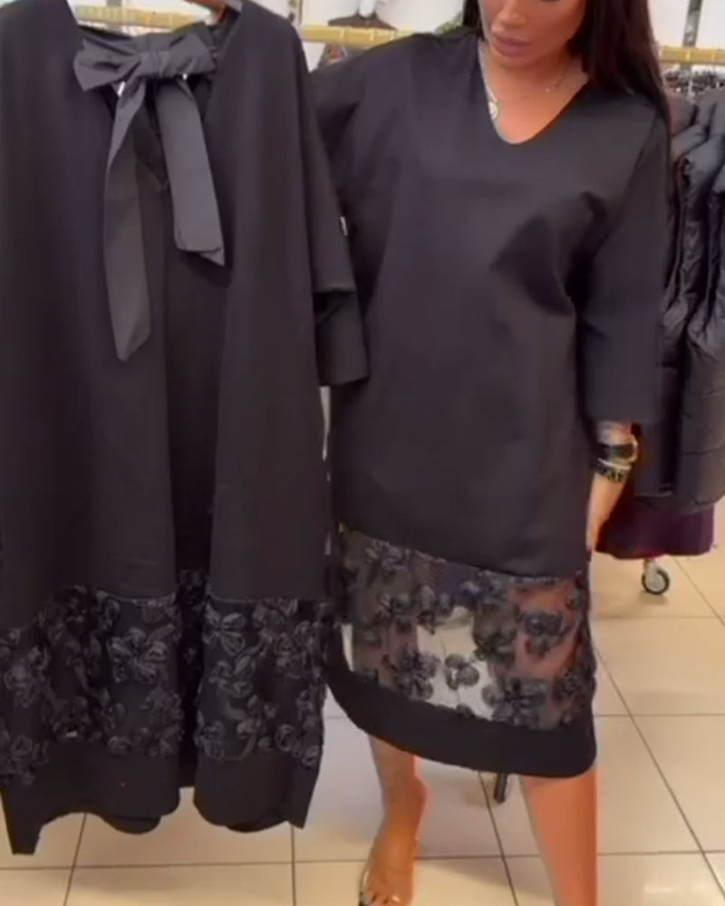 Stilfull Klänning Med Rosett På Ryggen Och V-Ringning