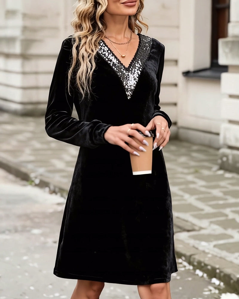 Elegant klänning med v-ringning och paljetter