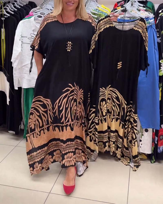 Tryckt rund halsad kortärmad lös klänning med snörning