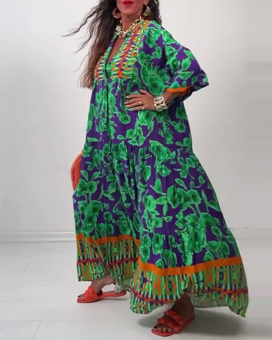 V-ringad lång avslappnad klänning med tryck