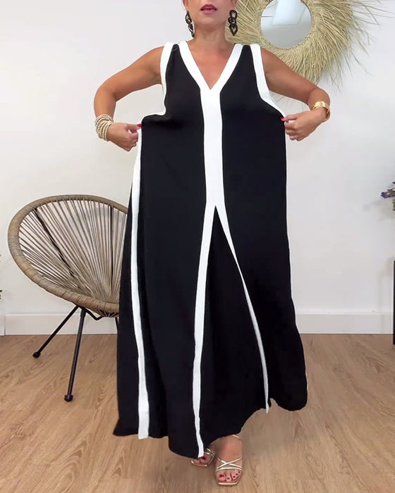 Trendig ärmlös klänning med V-ringad kontrasttryck