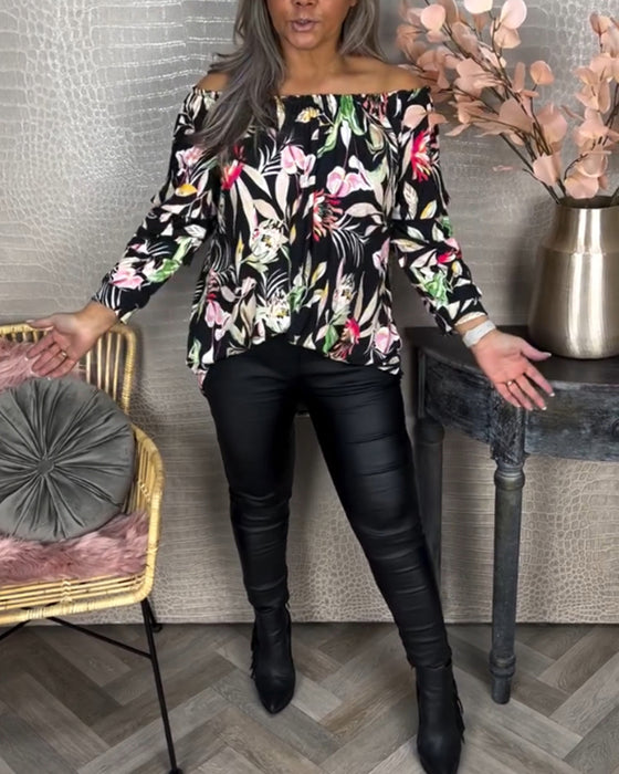 Blus med tryck och en axel