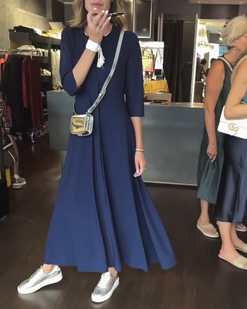 Enfärgad klänning med V-ringad midja