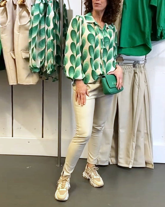 Blus med slag och tryck