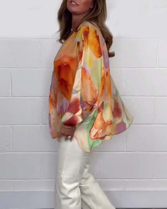 Avslappnad blus med V-ringning och lång ärm