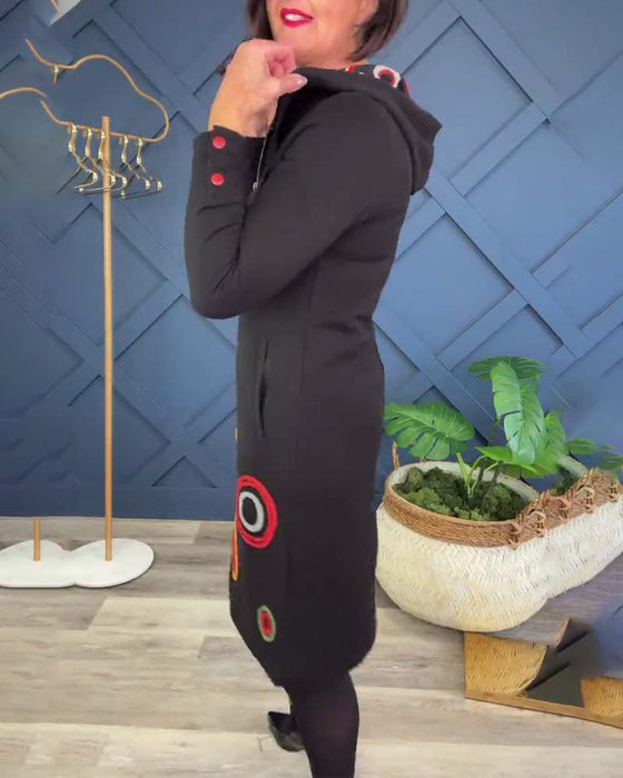 Avslappnad klänning med luva i cirkeltryck med dragkedja