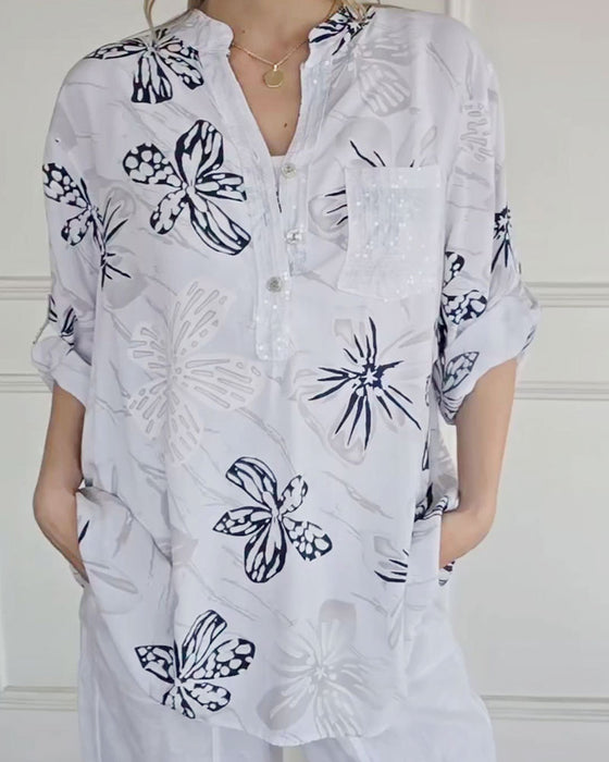 Blus Blomsterknappning V-hals