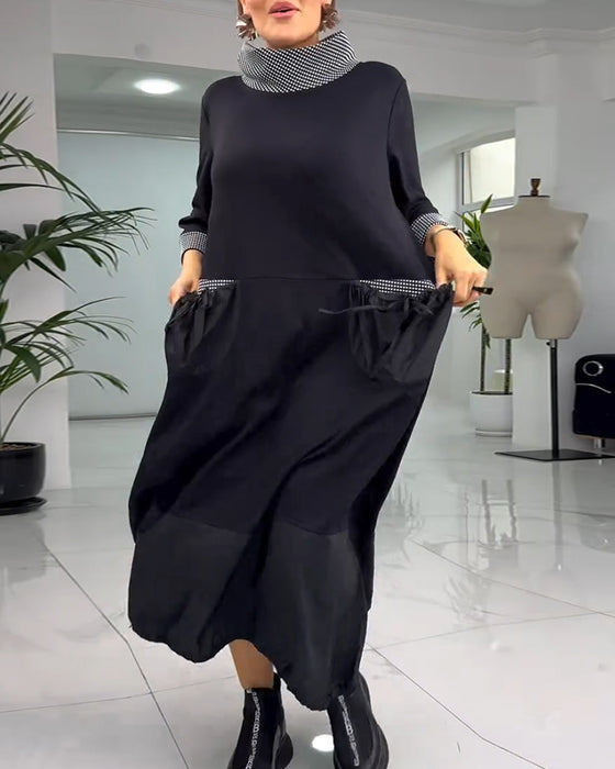 Avslappnad rutig lappklänning med hög krage