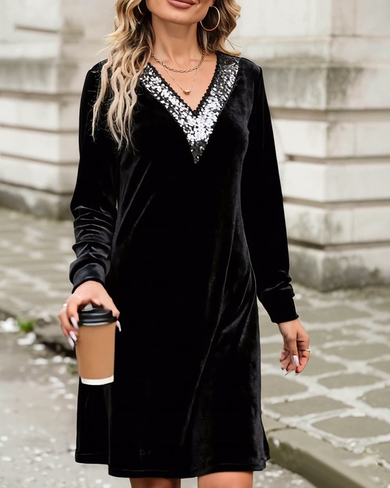 Elegant klänning med v-ringning och paljetter