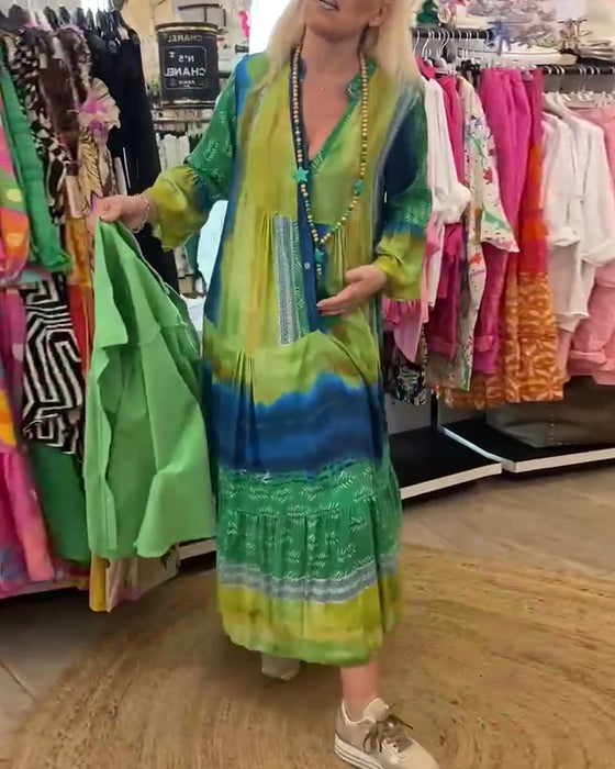 Tryckt avslappnad V-ringad lång klänning med utsvängda ärmar