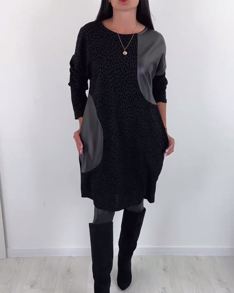 Elegant klänning med rund hals och panel