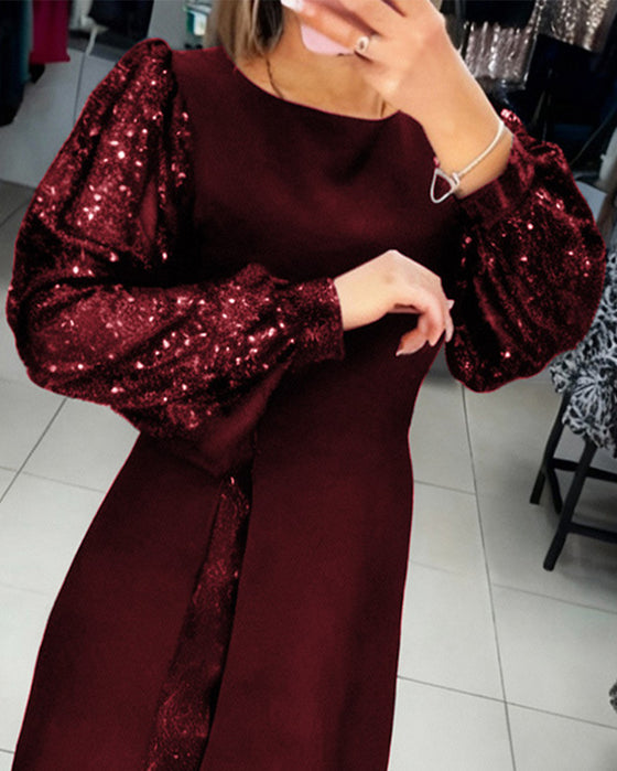 Elegant Klänning Med Puffärmar Och Lapptäcktsdetaljer