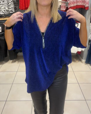 Löst topp med långa ärmar och dragkedja