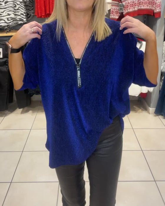 Löst topp med långa ärmar och dragkedja