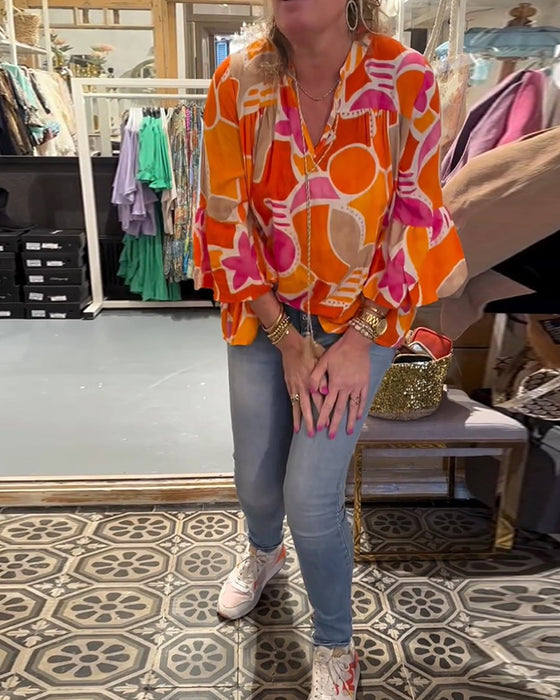 Blus med färgstarkt och långärmad design
