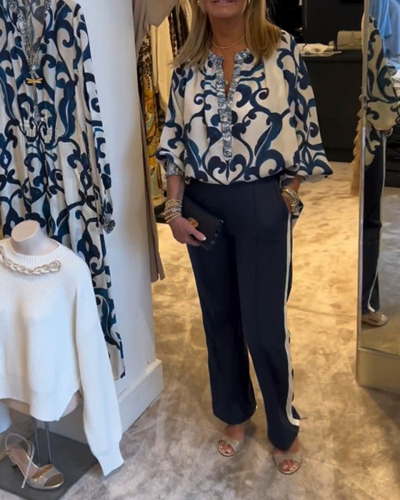 Blus i retromönster med lyktaärm