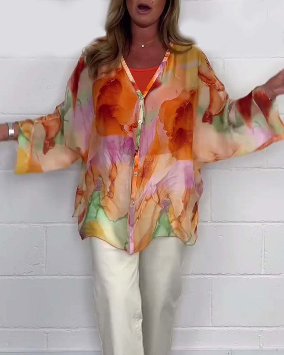 Avslappnad blus med V-ringning och lång ärm