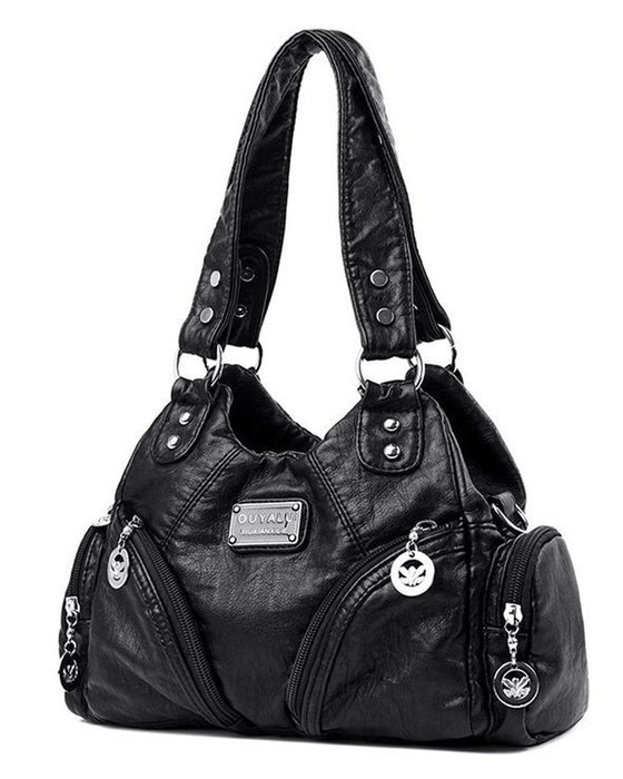 Vintage mjuk läderhandväska och budbärarväska.