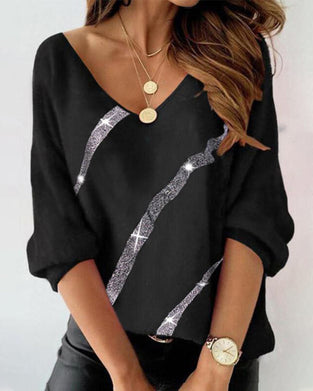 Långärmad topp med bokstavs- och fjädertryck