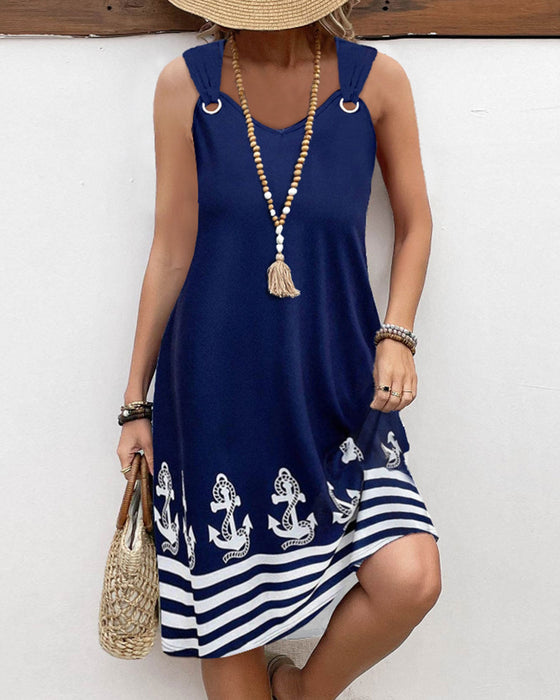 Avslappnad hängsel med lapptäcke randig klänning