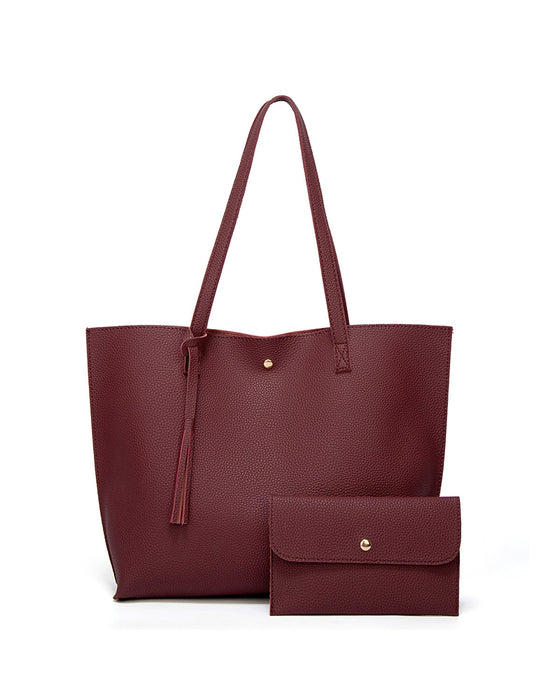 Kapacitet med enfärgad tofs axelväska med stor