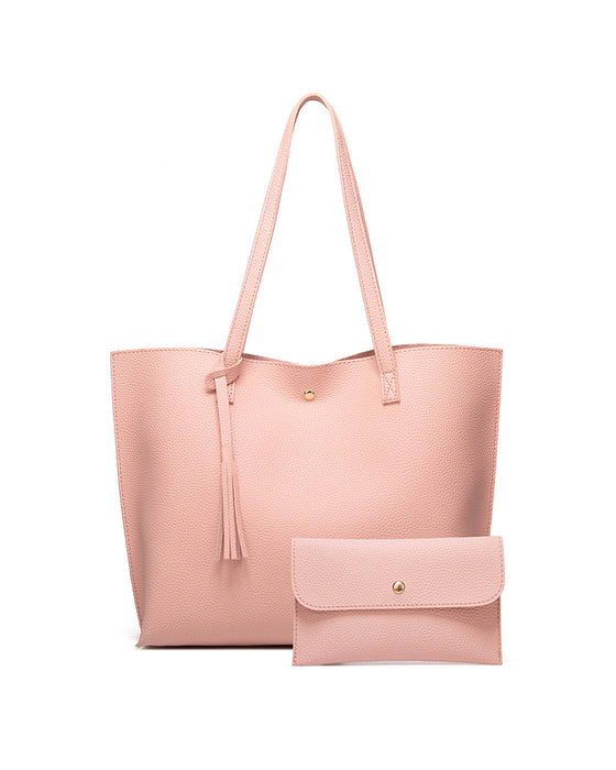 Kapacitet med enfärgad tofs axelväska med stor