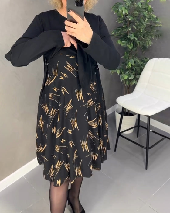 Avslappnad klänning med lös passform och rund hals