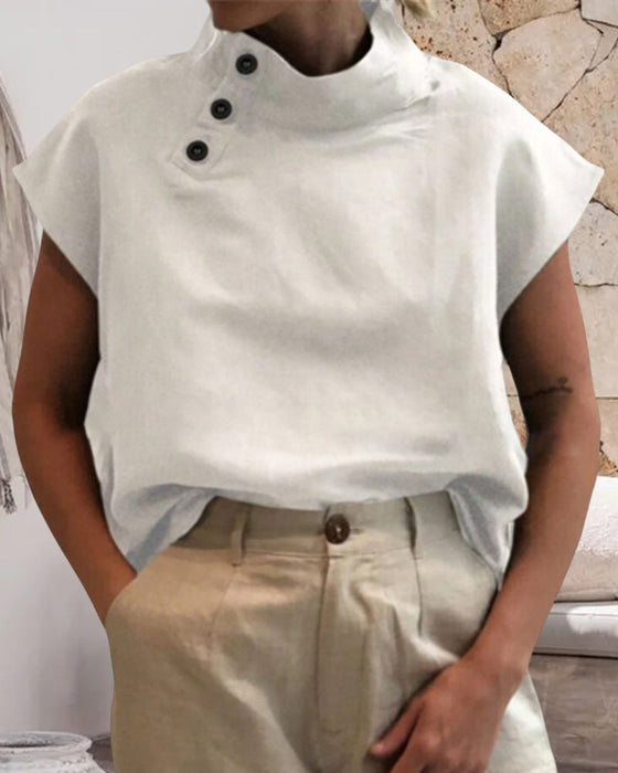 Topp med knappar och stativkrage i bomull och linne