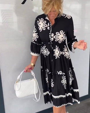 Blommig klänning med 3/4 ärm