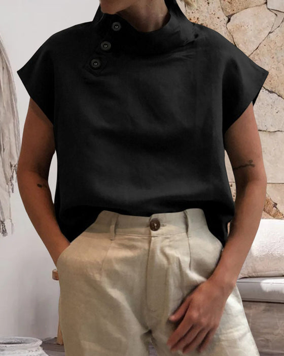 Topp med knappar och stativkrage i bomull och linne