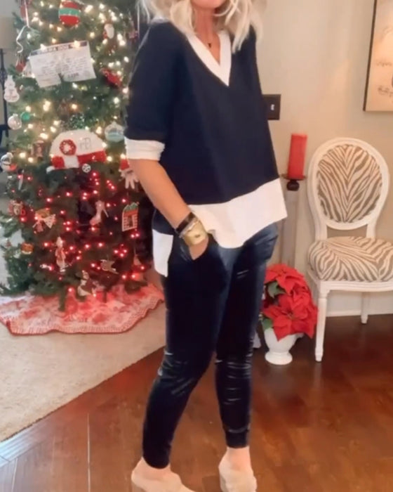 Avslappnad topp med v-ringning och färgblock