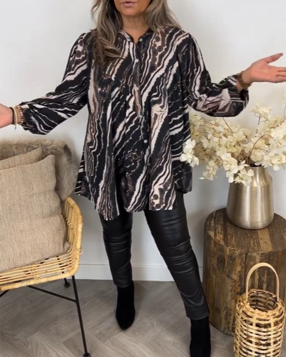 Blus med retrostil och långa ärmar