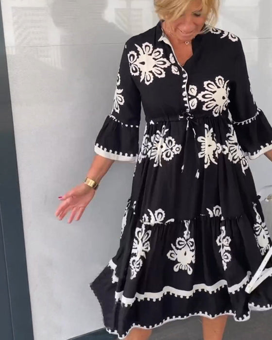 Blommig klänning med 3/4 ärm