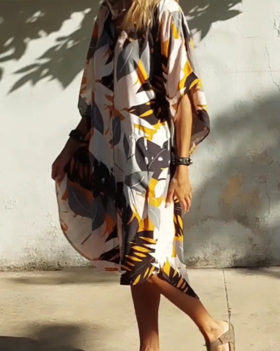 Klänning med fickor och lönnlövstryck